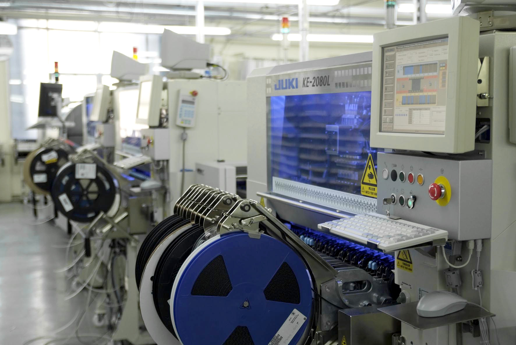 JUKI KE-2080L pick-and-place machine with reel feeders in clean factory